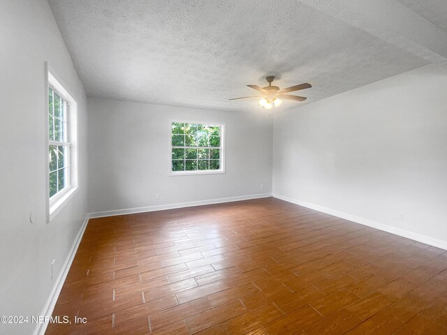 unfurnished room featuring ceiling fan and a textured ceiling