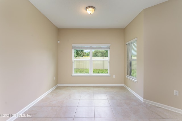 spare room with light tile patterned flooring