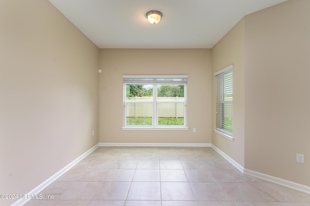 empty room featuring light tile patterned flooring