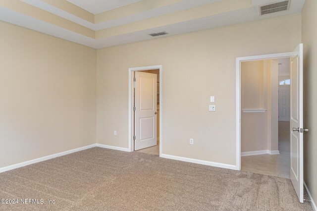 unfurnished bedroom with light carpet