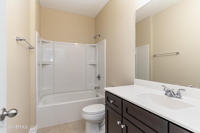 full bathroom with tile patterned flooring, vanity, shower / washtub combination, and toilet