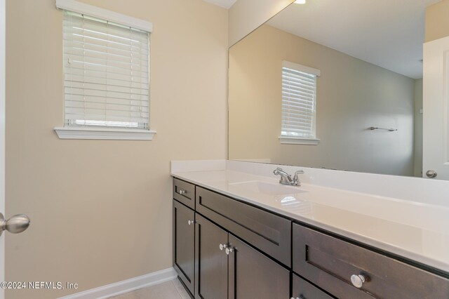 bathroom featuring tile patterned floors and vanity