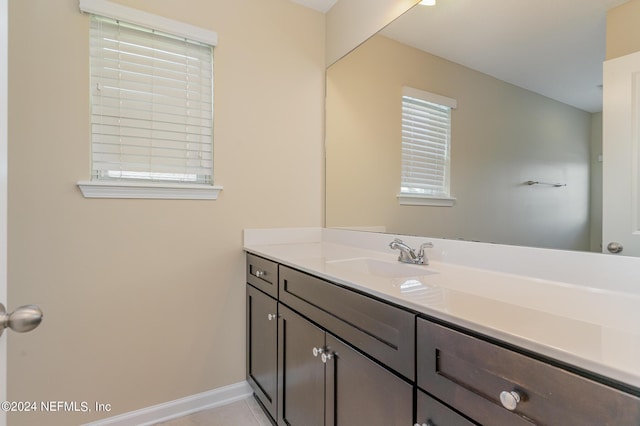 bathroom with vanity and tile patterned floors