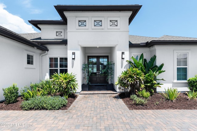 doorway to property featuring french doors