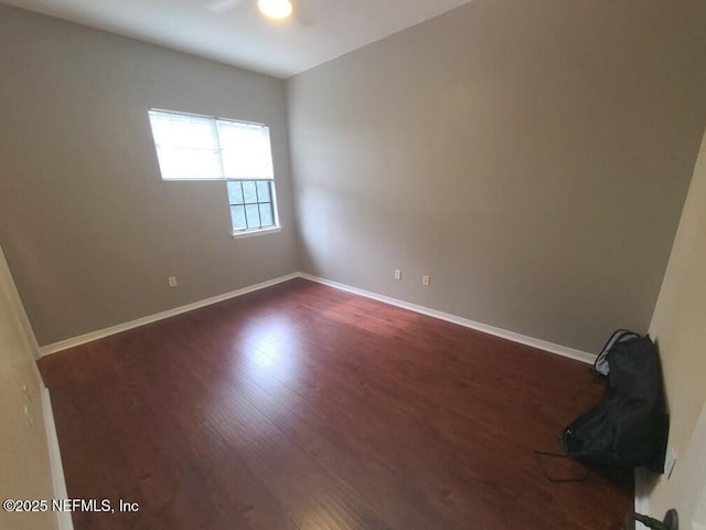 empty room featuring dark wood-type flooring