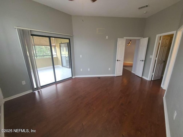 empty room featuring ceiling fan and dark hardwood / wood-style flooring