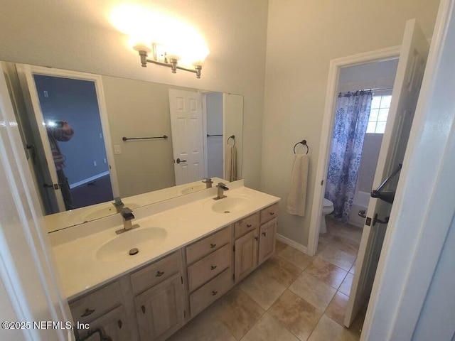 bathroom featuring toilet and vanity