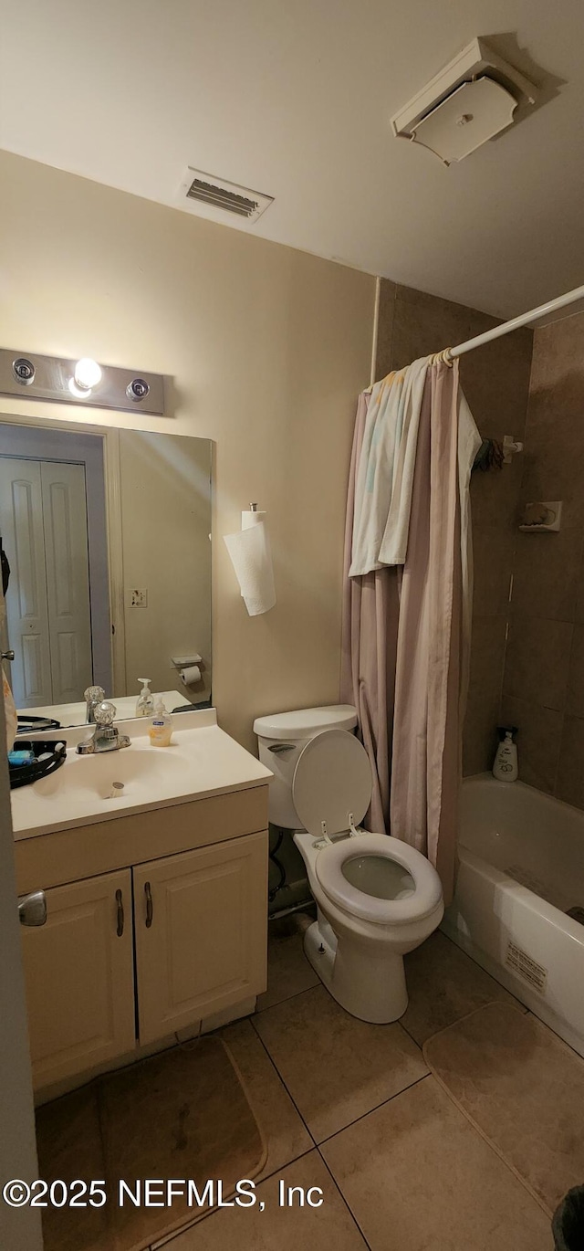 full bathroom with vanity, tile patterned floors, toilet, and shower / bath combo