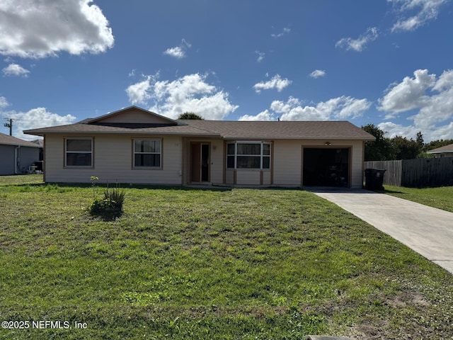 single story home with a garage and a front yard