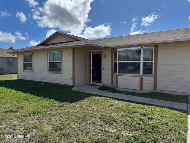 view of front of home with a front lawn