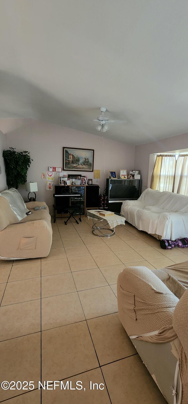 bedroom featuring tile patterned floors and ceiling fan