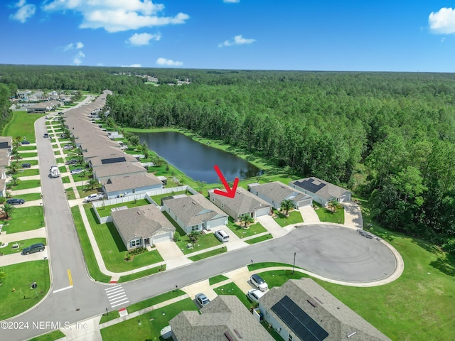 birds eye view of property with a water view, a forest view, and a residential view