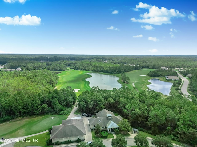 bird's eye view with a forest view, golf course view, and a water view