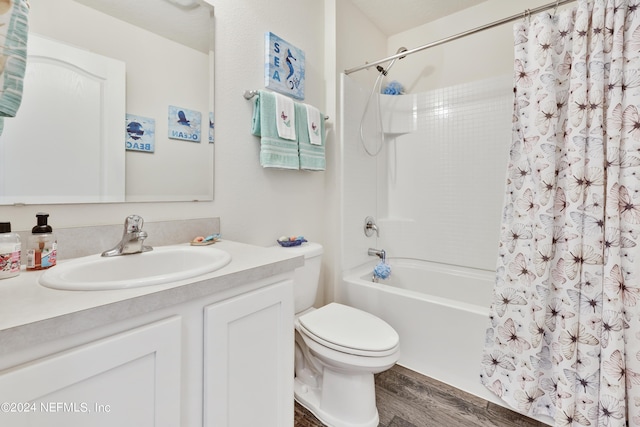 bathroom with shower / tub combo with curtain, vanity, toilet, and wood finished floors