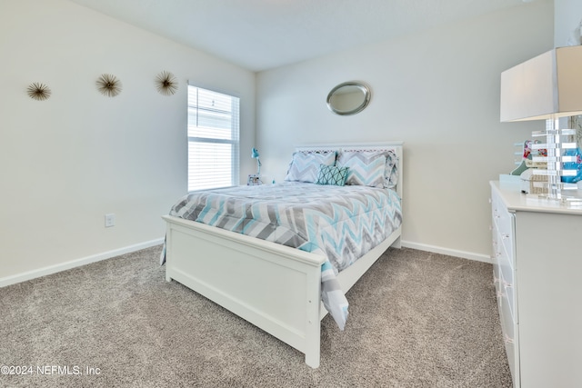 bedroom with light colored carpet