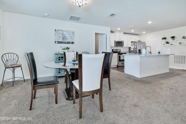 dining room featuring carpet floors, recessed lighting, and visible vents