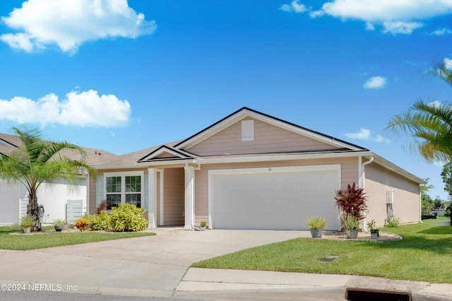 ranch-style home featuring a front yard, concrete driveway, and an attached garage