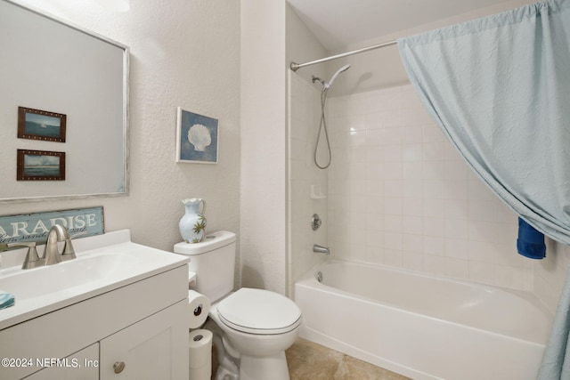 bathroom with bathtub / shower combination, a textured wall, toilet, vanity, and tile patterned flooring