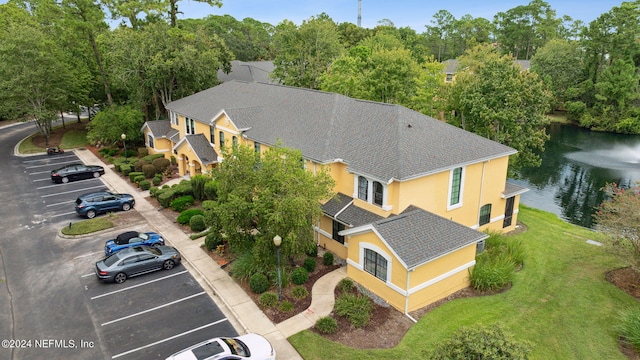 birds eye view of property with a water view