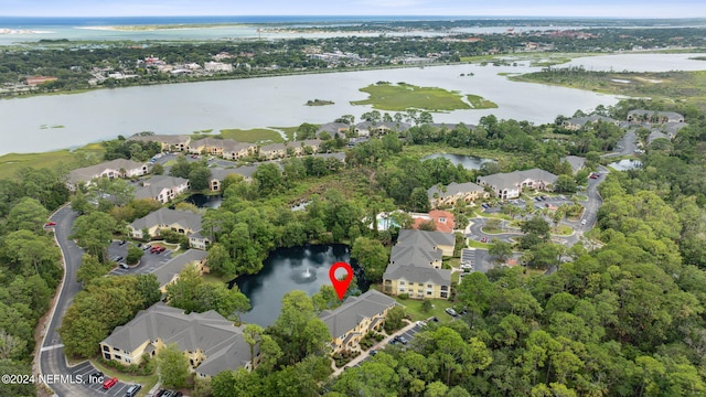 birds eye view of property featuring a water view and a residential view