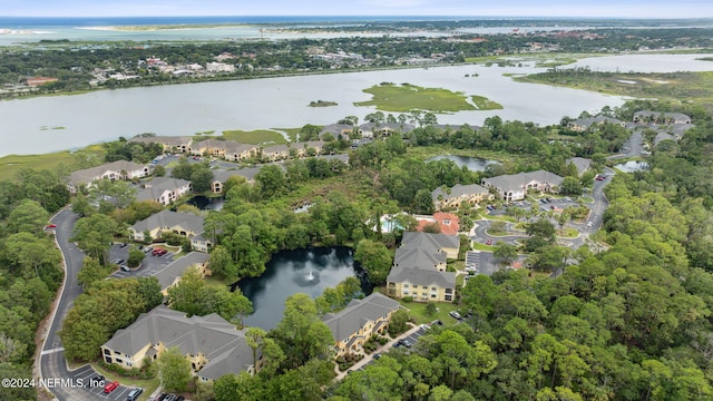 birds eye view of property featuring a water view and a residential view