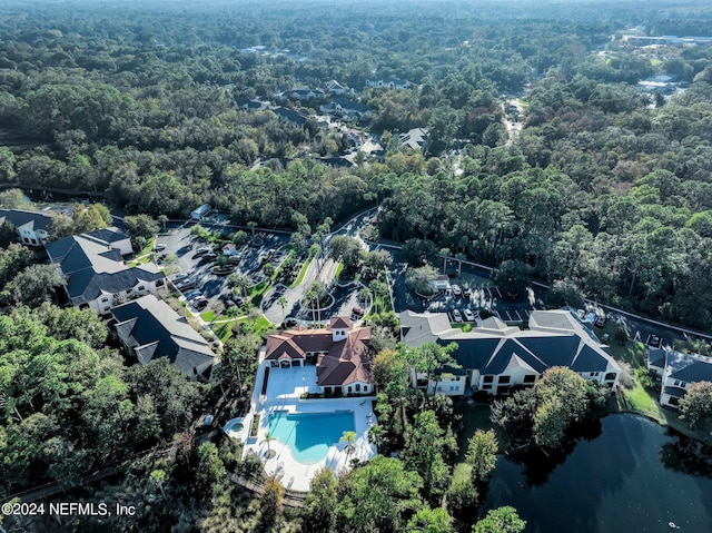 aerial view with a water view, a residential view, and a view of trees