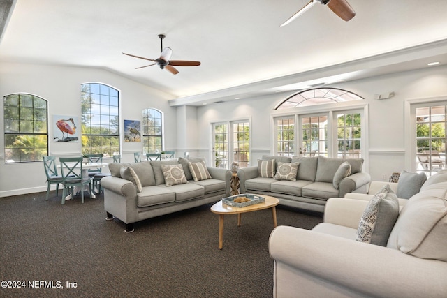 living area featuring ceiling fan, vaulted ceiling, and carpet flooring