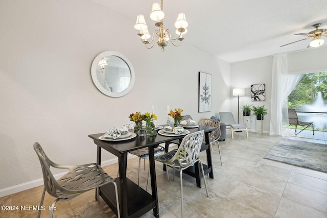 dining area with a chandelier, light tile patterned flooring, and baseboards