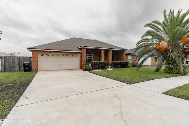 ranch-style home featuring a front yard and a garage