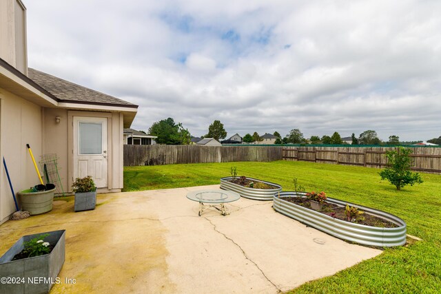 view of patio with a fire pit