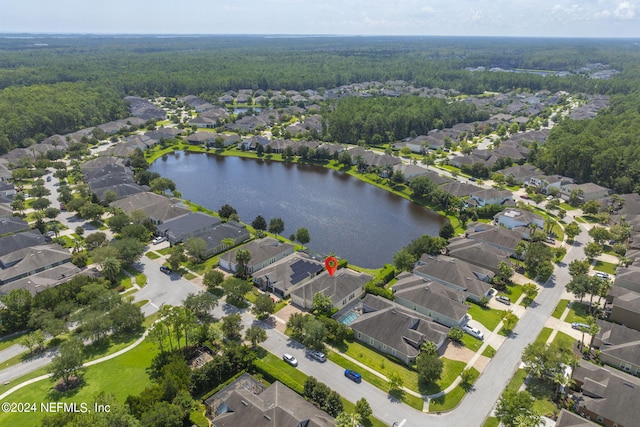 birds eye view of property featuring a residential view and a water view