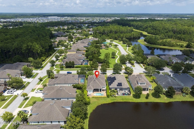 birds eye view of property featuring a residential view and a water view