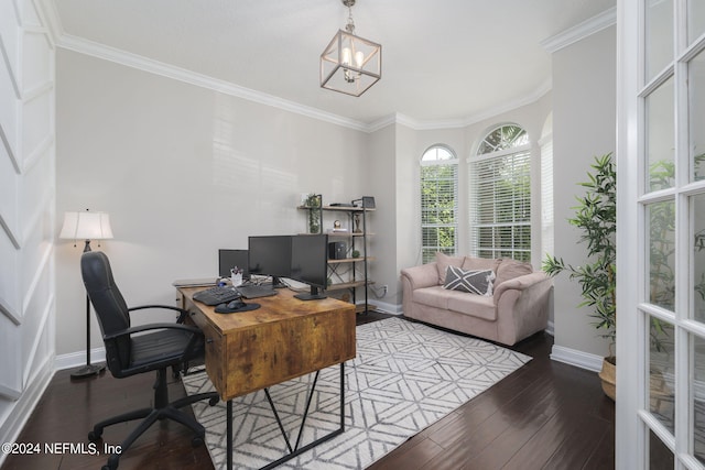 office space featuring ornamental molding, baseboards, a notable chandelier, and hardwood / wood-style floors