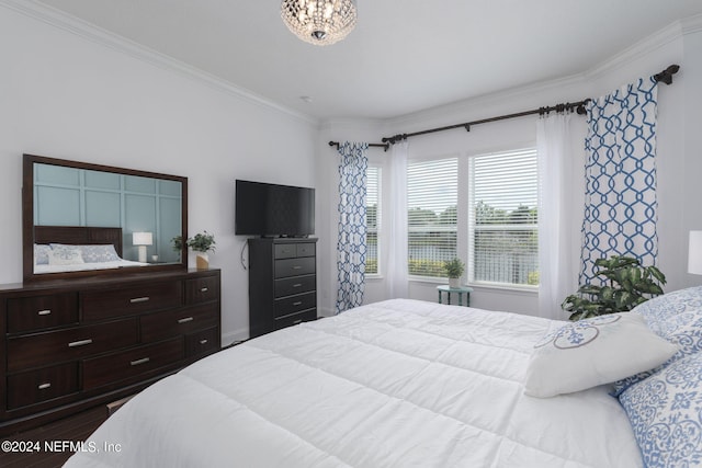 bedroom with dark wood-type flooring and crown molding