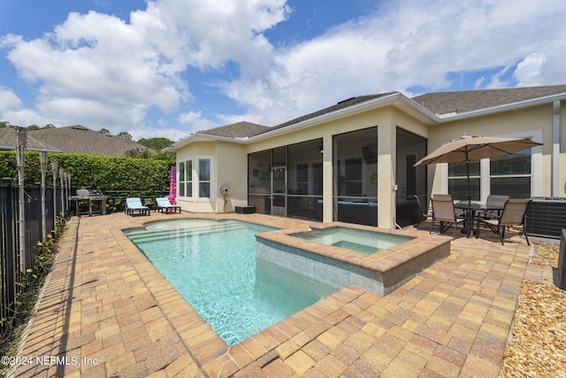 view of swimming pool featuring a fenced in pool, a patio, a sunroom, an in ground hot tub, and fence