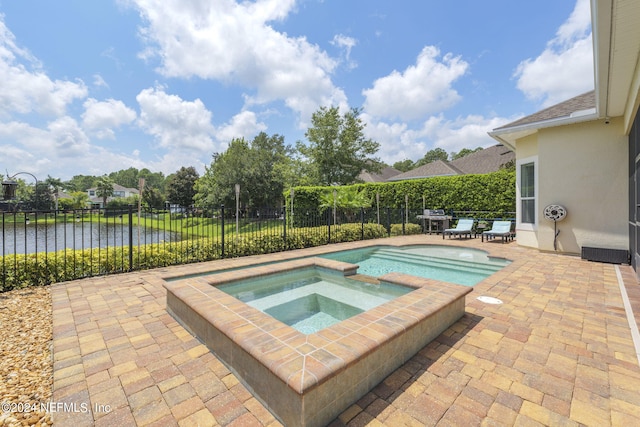 view of pool with an in ground hot tub, a patio area, a fenced backyard, and a fenced in pool