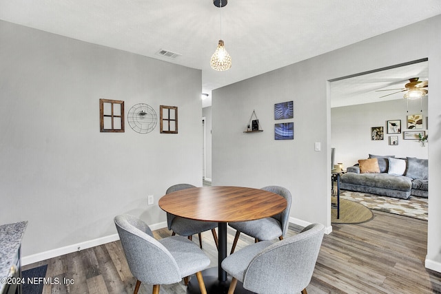 dining room featuring hardwood / wood-style floors and ceiling fan