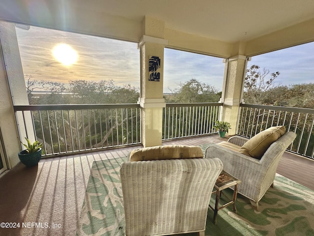 view of balcony at dusk