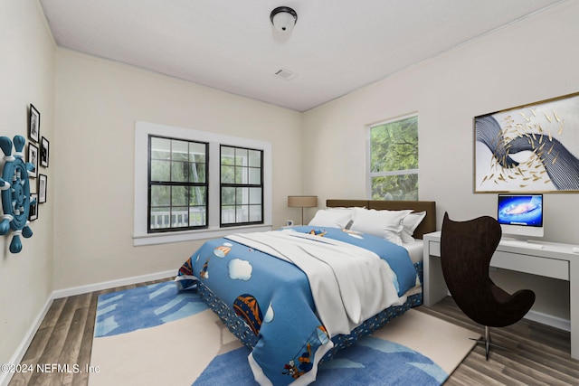 bedroom featuring hardwood / wood-style flooring