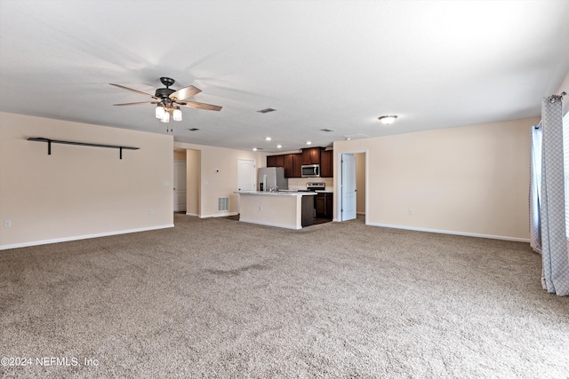 unfurnished living room with light carpet, baseboards, visible vents, and a ceiling fan