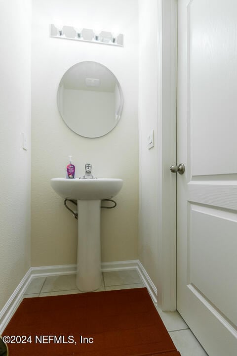 bathroom with tile patterned flooring