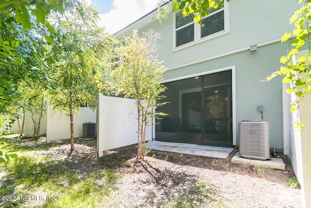 back of property with central air condition unit