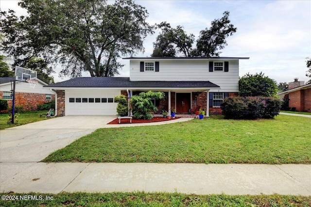 traditional-style home featuring a garage, concrete driveway, brick siding, and a front yard