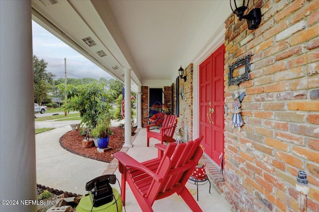 view of patio featuring a porch