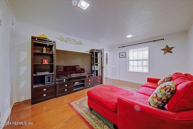 living room featuring wood finished floors and baseboards