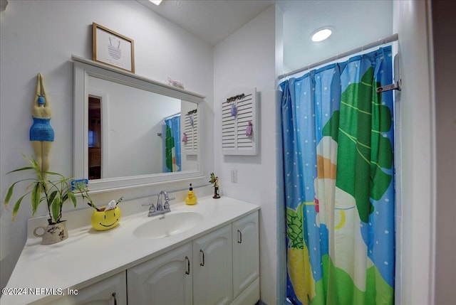 full bath featuring vanity and a shower with curtain