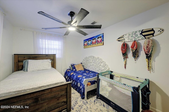 bedroom with visible vents and a ceiling fan