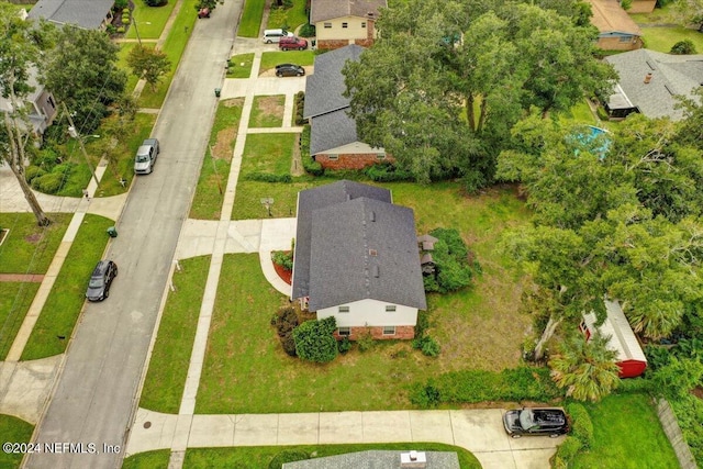 birds eye view of property with a residential view