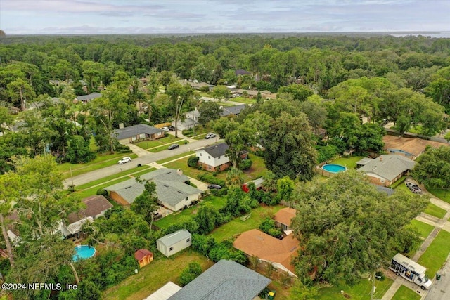 aerial view featuring a wooded view