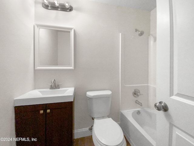 full bathroom with a textured ceiling, vanity, bathtub / shower combination, and toilet